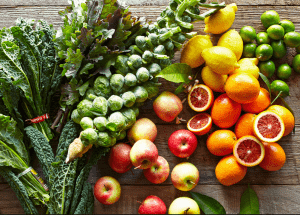 a group of fruits and vegetables on a wood surface Healthy Weight Loss Diets Hucknall under Huthwaite