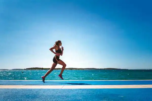 Woman running showing strong leg muscle Hucknall under Huthwaite